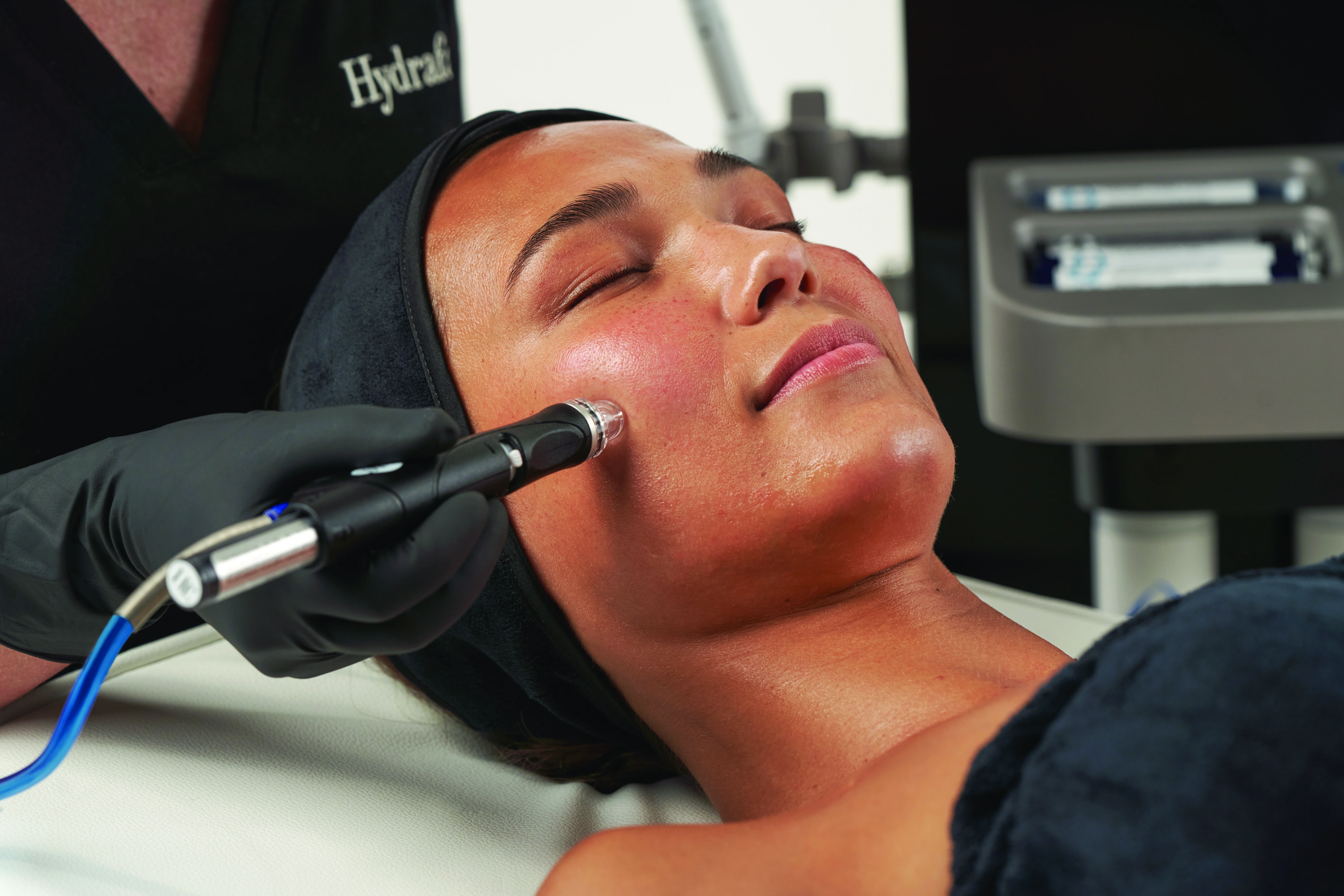 Skin therapist performing a gentle, calming Dermalux LED session on a patient with sensitive, reactive skin during doctor-led care at Rejuvena Clinic, Bedford