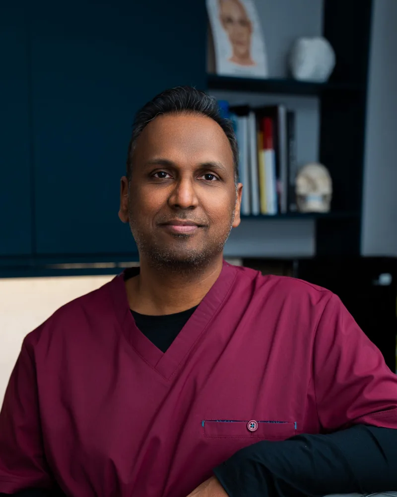 Dr Nick (Dr P Nosina), GMC-registered Medical Director, in clinical scrubs at Rejuvena Clinic, Bedford