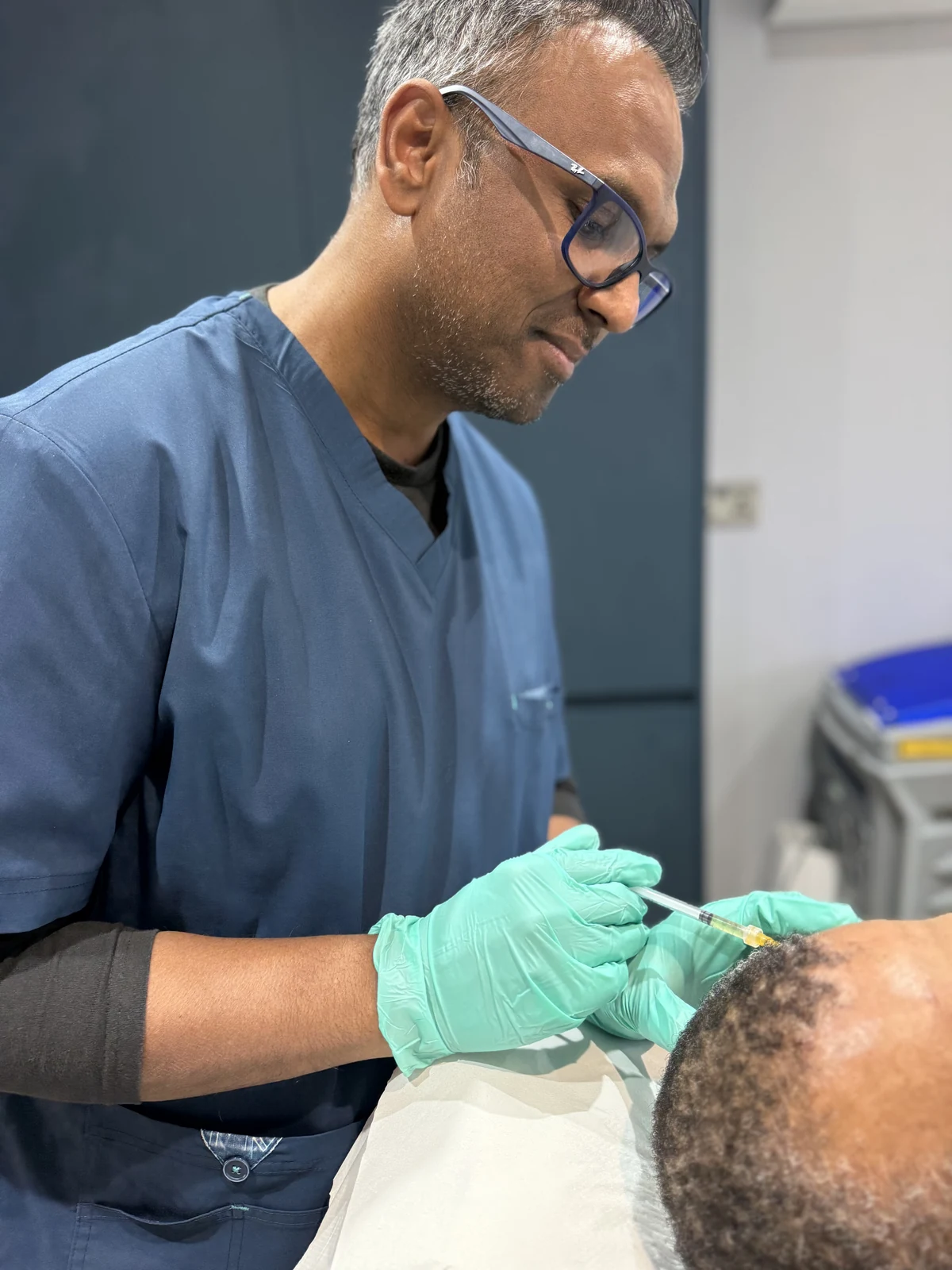 Dr Nick, Medical Director, performing a doctor-led PRP scalp treatment during hair loss treatment at Rejuvena, Bedford