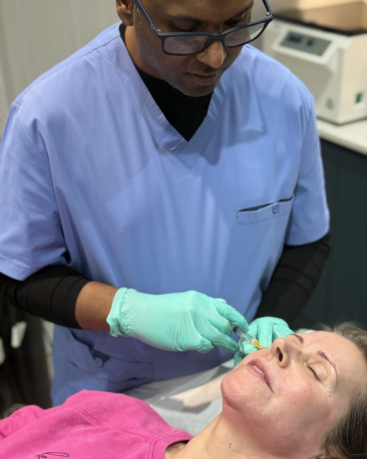 Dr Nick administering anti-wrinkle injections to a patient’s forehead at Rejuvena Clinic, Bedford