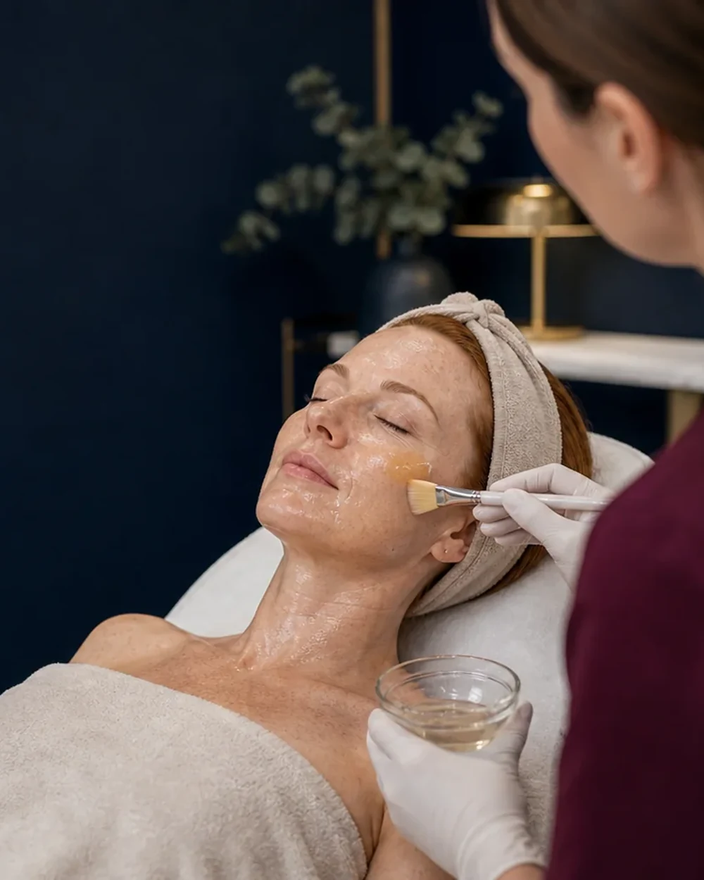 A clinician applying The Perfect Peel&reg; medical-grade chemical peel to a patient’s face at Rejuvena Clinic, Bedford