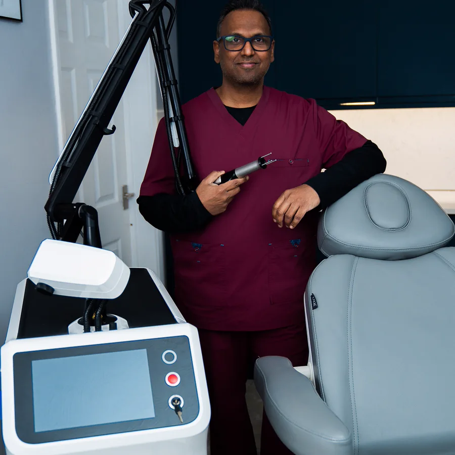 Dr Nick holding the Cool Laser handpiece at Rejuvena Clinic in Bedford