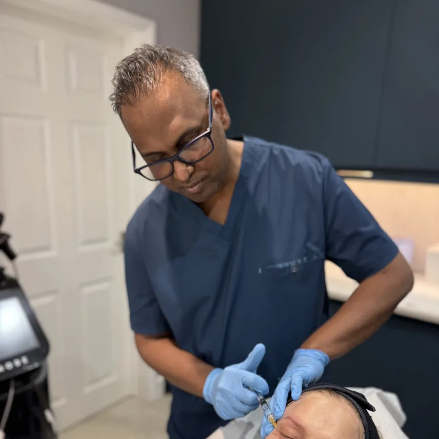 Dr Nick performing a doctor-led skin-booster treatment on a patient at Rejuvena Clinic in Bedford