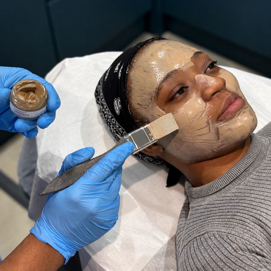 A Cosmelan depigmentation mask being brushed onto a patient’s face at Rejuvena Clinic, Bedford