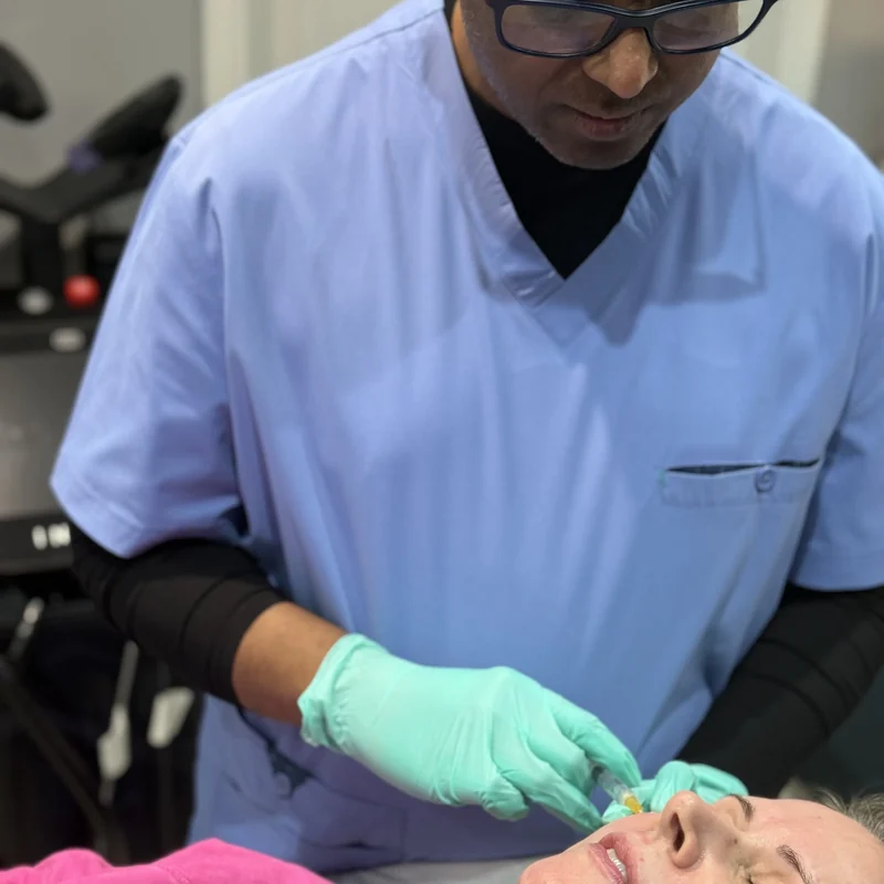 Dr Nick performing a doctor-led collagen-stimulating injection at Rejuvena, Bedford