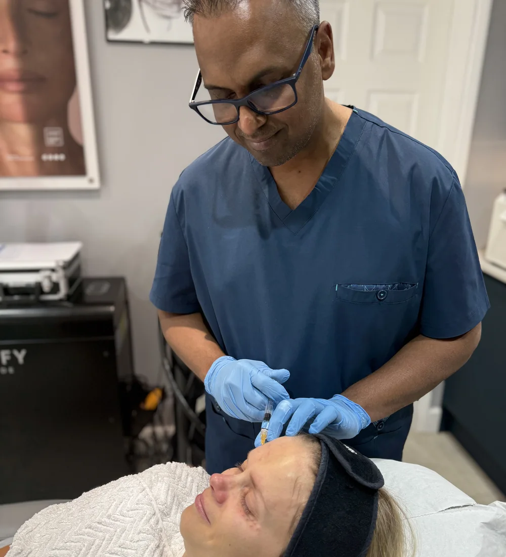 Dr Nick administering a hyaluronic acid based skin booster treatment at Rejuvena, Bedford