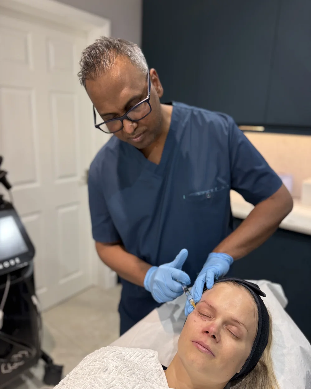 Dr Nick administering a doctor-led skin-booster injection at Rejuvena Clinic, Bedford