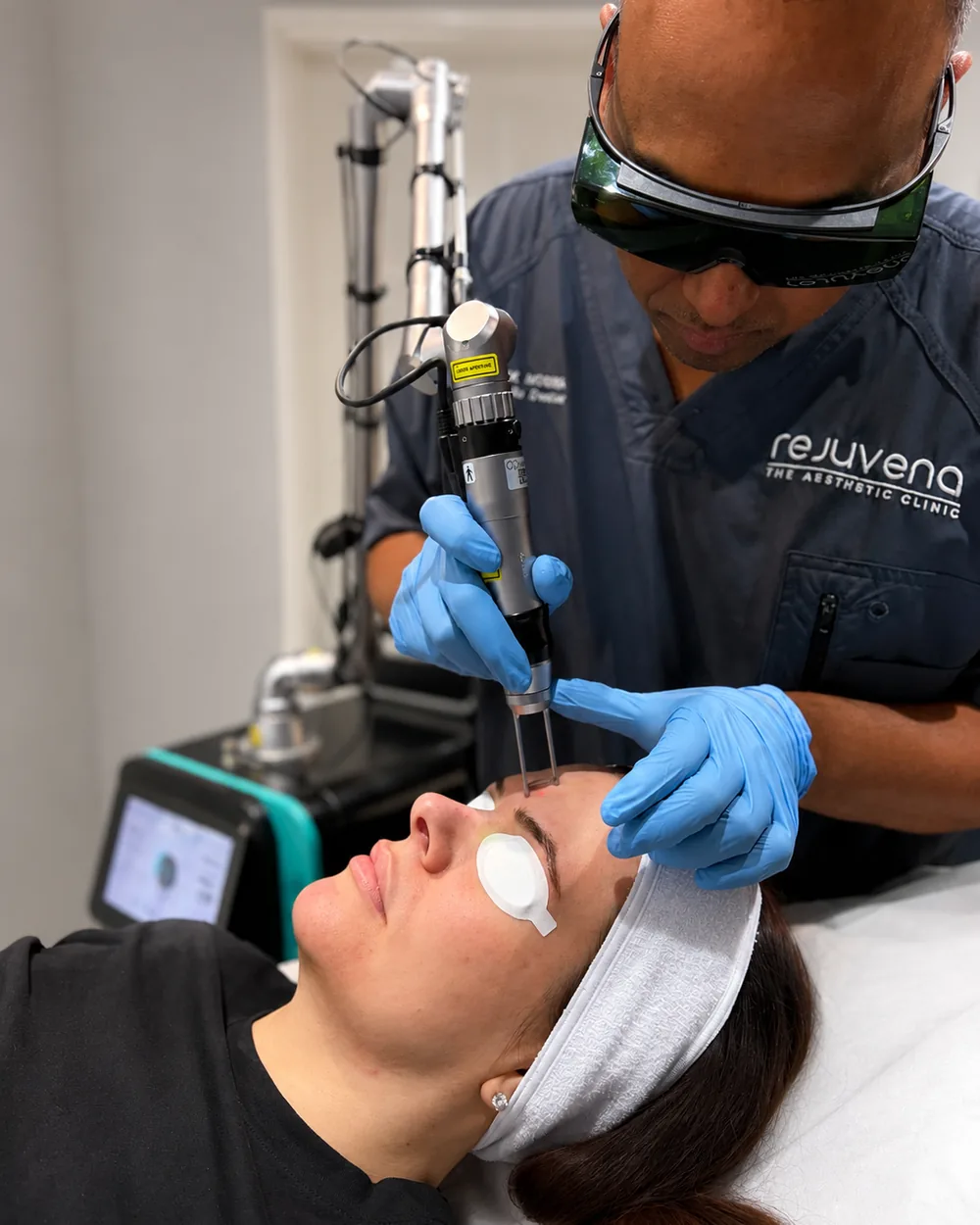 Dr Nick treating a patient’s forehead with the Picofy picosecond laser at Rejuvena Clinic in Bedford